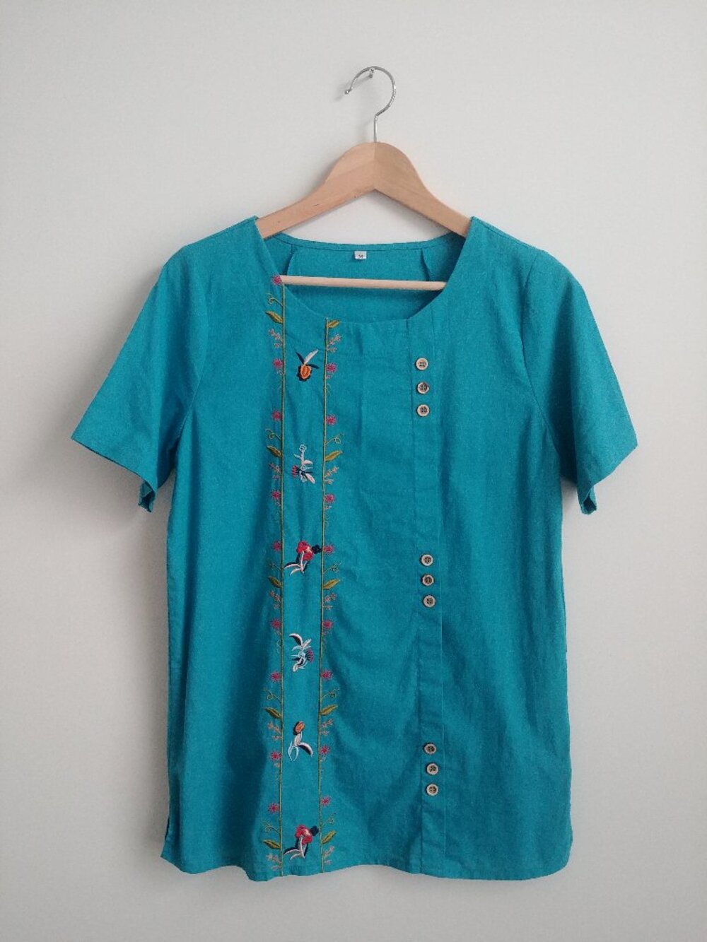Medium bright blue embroidered short sleeve blouse top